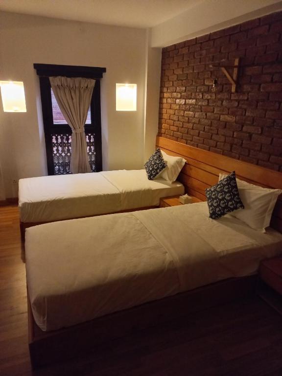 Postel nebo postele na pokoji v ubytování Subha Casa Hotel