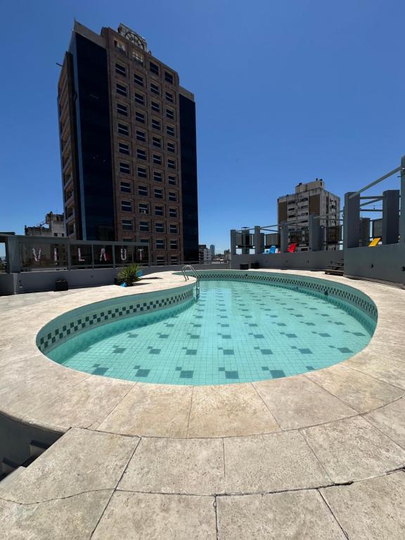 Bazén v ubytování Departamento amoblado 1 dorm con amenities 516 INVERHOME INMOBILIARIA nebo v jeho okolí