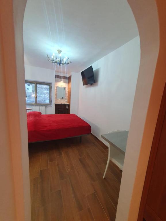 Postel nebo postele na pokoji v ubytování Il RIFUGIO DELLO SCIATORE RESIDENCE PARADISO