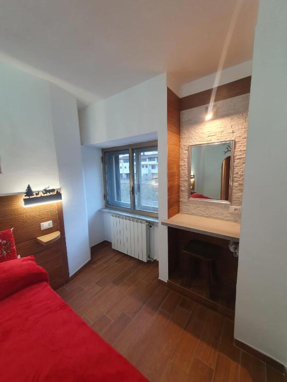 Postel nebo postele na pokoji v ubytování Il RIFUGIO DELLO SCIATORE RESIDENCE PARADISO