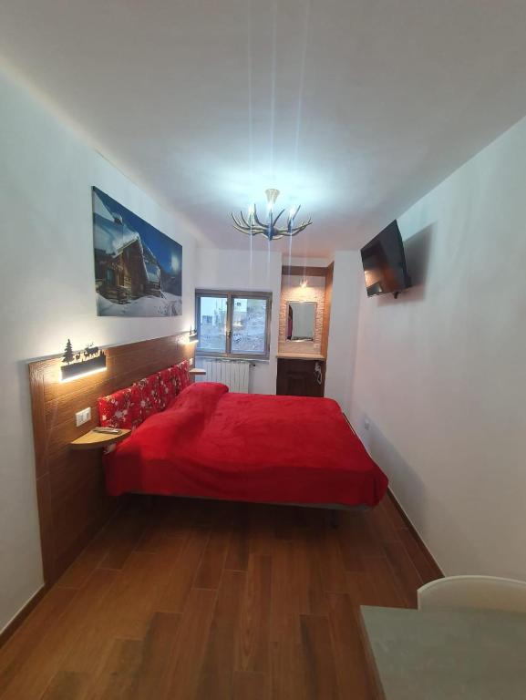Postel nebo postele na pokoji v ubytování Il RIFUGIO DELLO SCIATORE RESIDENCE PARADISO
