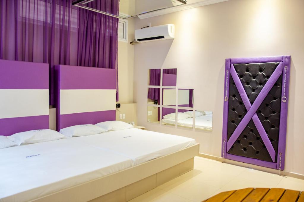 Postel nebo postele na pokoji v ubytování Motel Itapuã I Fx Nova Camobi