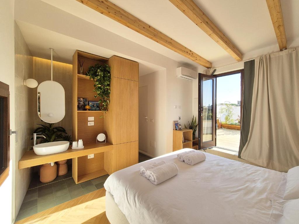 Postel nebo postele na pokoji v ubytování Suite Torre San Giorgio
