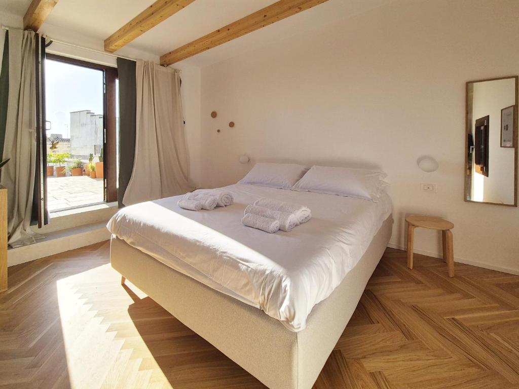 Postel nebo postele na pokoji v ubytování Suite Torre San Giorgio