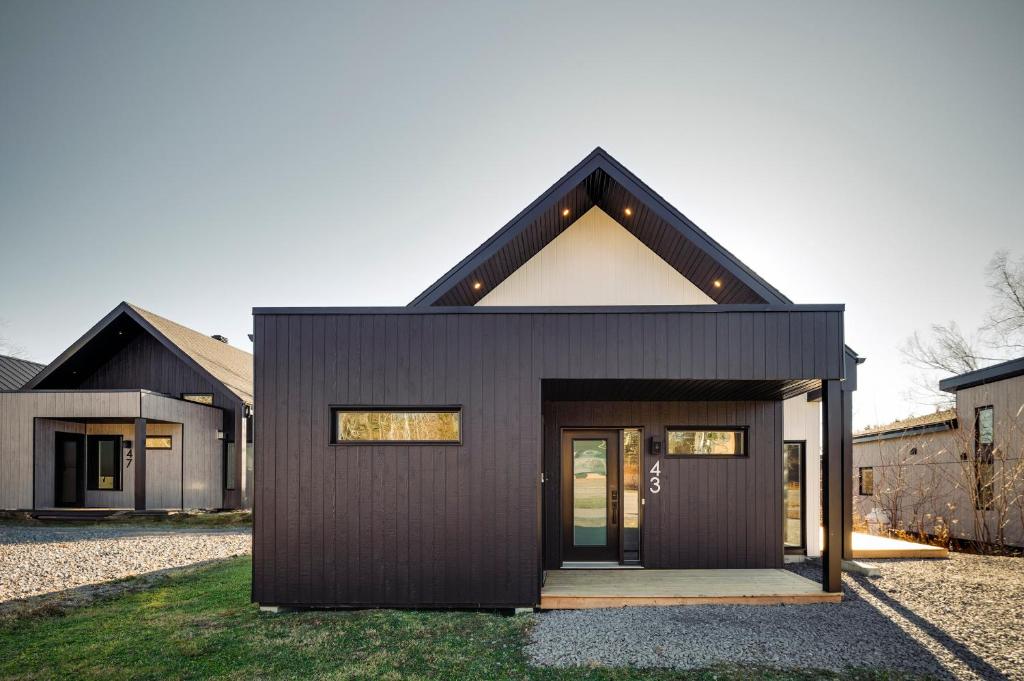 a black house with a pitched roof at White House 843 - 3 chambres - 8 personnes in Saint-Férréol-les-Neiges
