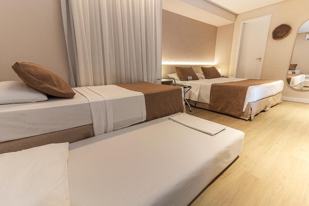 Cama ou camas em um quarto em Littoral Express