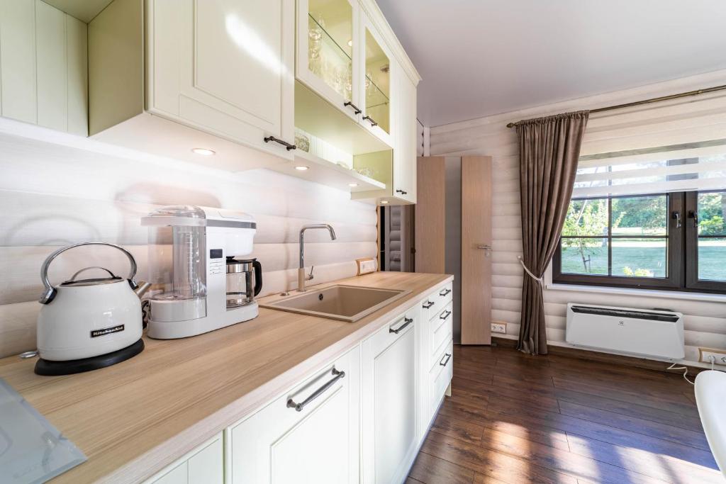 Kuchyň nebo kuchyňský kout v ubytování Hara Beach house