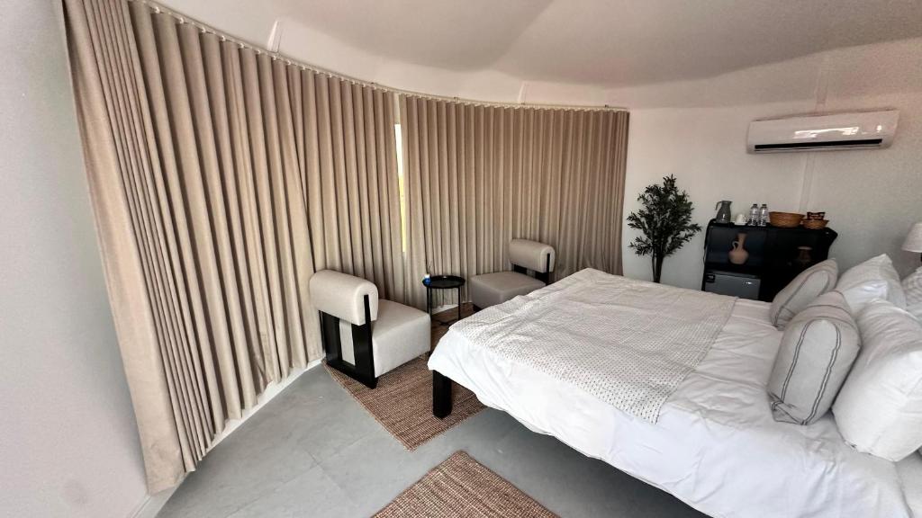 Letto o letti in una camera di Starry Domes Desert Camp