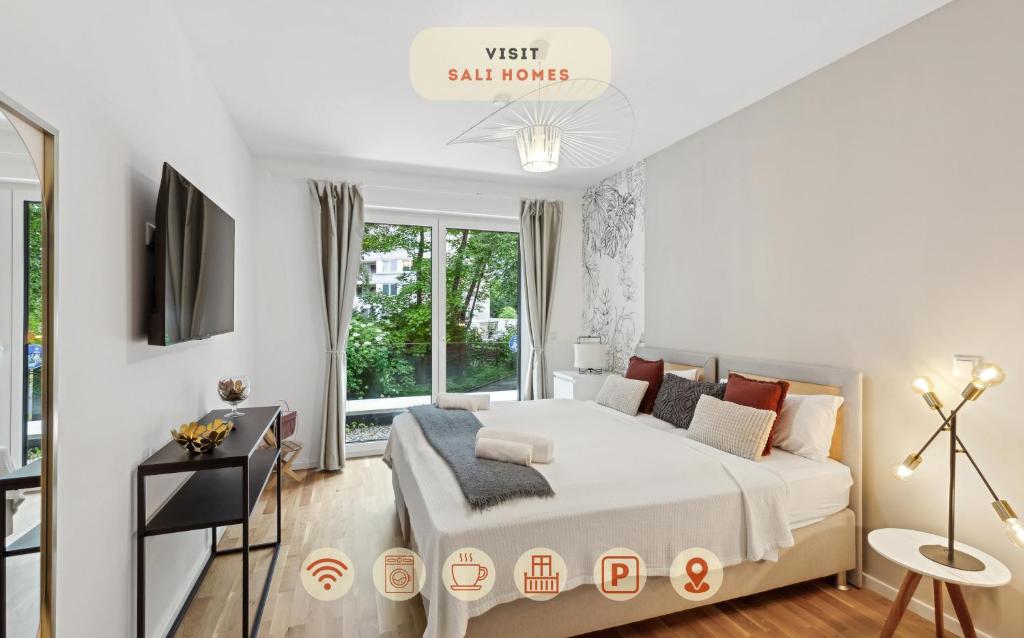 a white bedroom with a bed and a window at Sali-Homes R5 - New Build with Terrace in City Center in Bayreuth