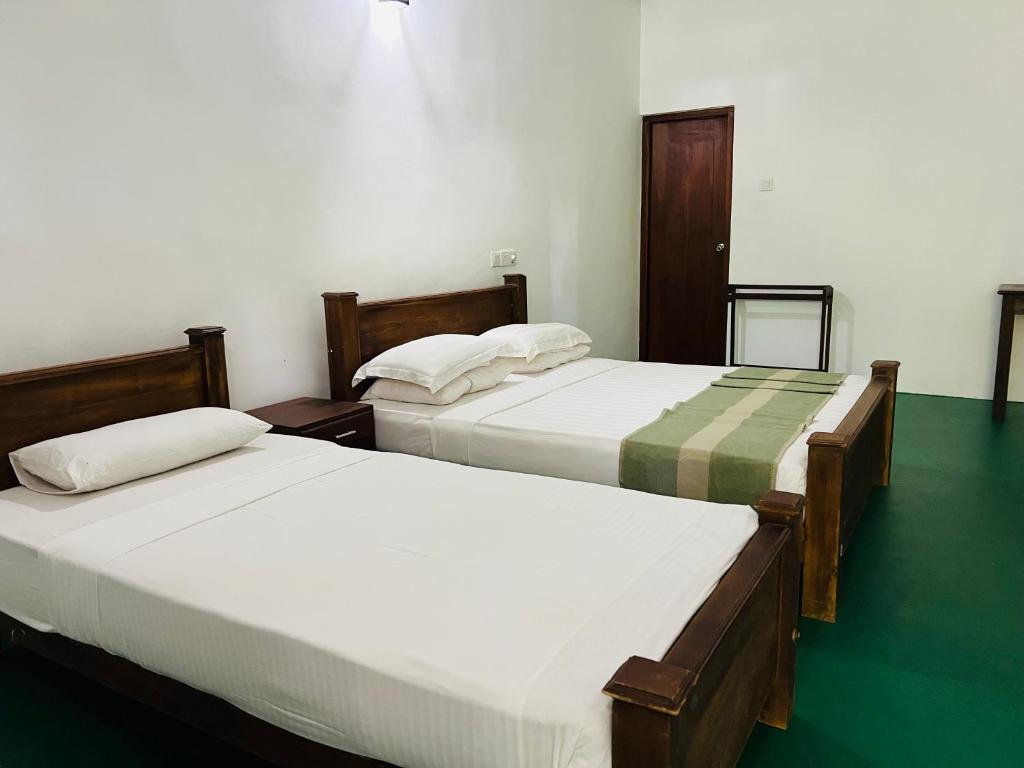 Postel nebo postele na pokoji v ubytování Kingfisher Resort & Retreat Sigiriya