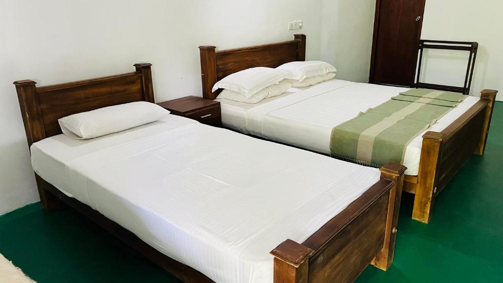 Postel nebo postele na pokoji v ubytování Kingfisher Resort & Retreat Sigiriya
