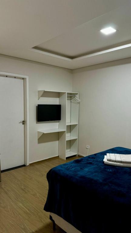 Postel nebo postele na pokoji v ubytování POUSADA DONATELLA Modernidade e conforto para noites tranquilas