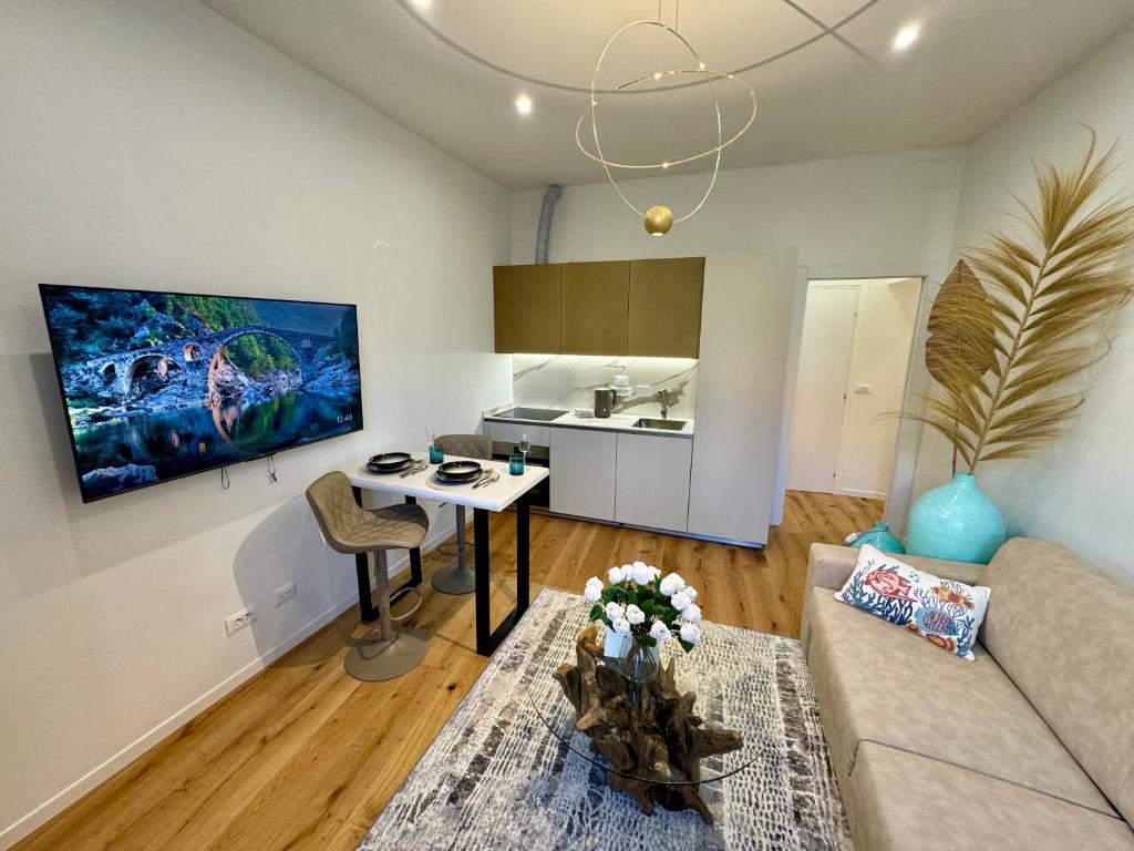 a living room with a couch and a table at Boutique Apartment Trieste in Trieste