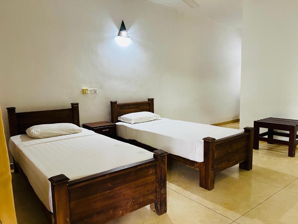 Postel nebo postele na pokoji v ubytování Kingfisher Resort & Retreat Sigiriya