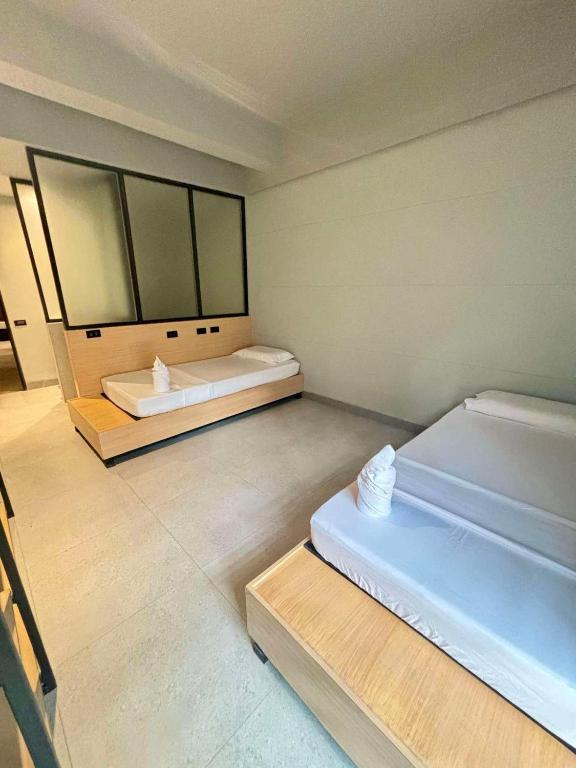 Postel nebo postele na pokoji v ubytování Maya Hostel El Nido