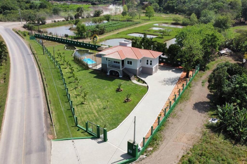 an aerial view of a house next to a road at Casa Sítio Caminhos Da Serra in Feliz