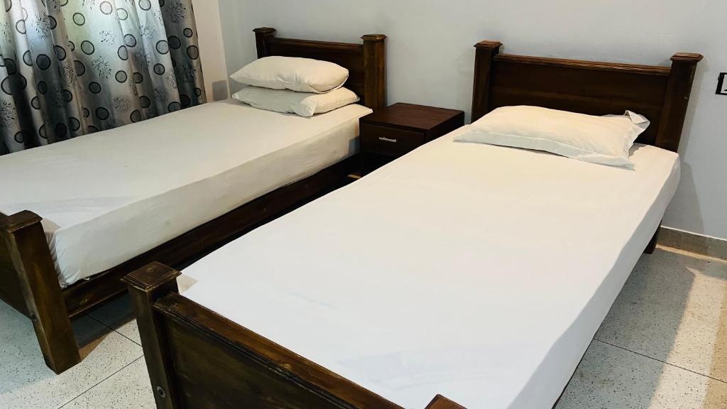 Postel nebo postele na pokoji v ubytování Kingfisher Resort & Retreat Sigiriya