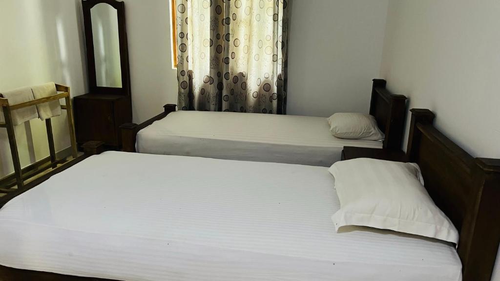 Postel nebo postele na pokoji v ubytování Kingfisher Resort & Retreat Sigiriya