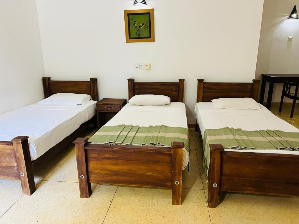 Postel nebo postele na pokoji v ubytování Kingfisher Resort & Retreat Sigiriya