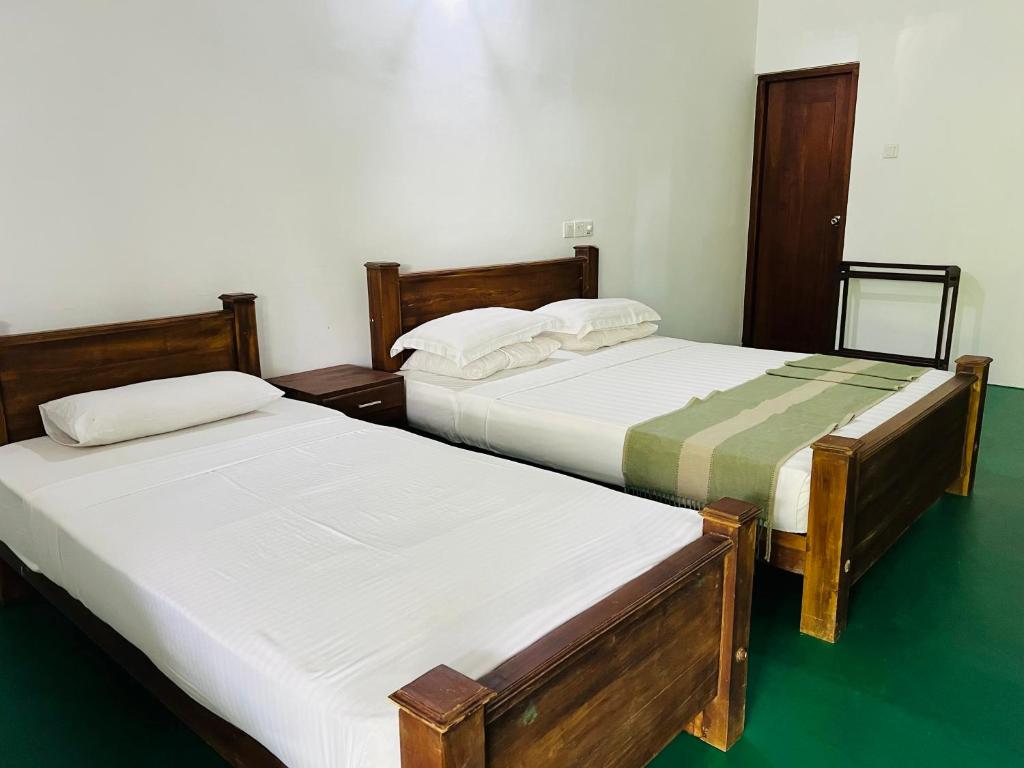 Postel nebo postele na pokoji v ubytování Kingfisher Resort & Retreat Sigiriya