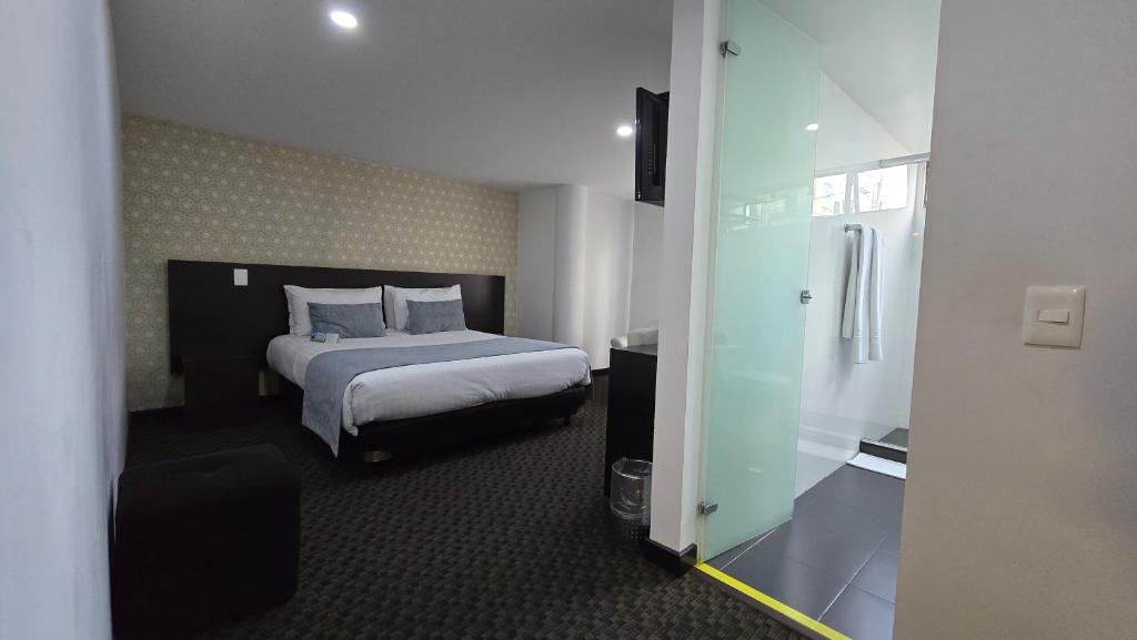 Postel nebo postele na pokoji v ubytování Castellana 95 Bogota By Hoteles Confort 80