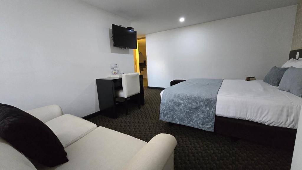 Postel nebo postele na pokoji v ubytování Castellana 95 Bogota By Hoteles Confort 80