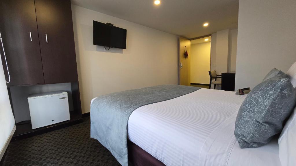 Postel nebo postele na pokoji v ubytování Castellana 95 Bogota By Hoteles Confort 80