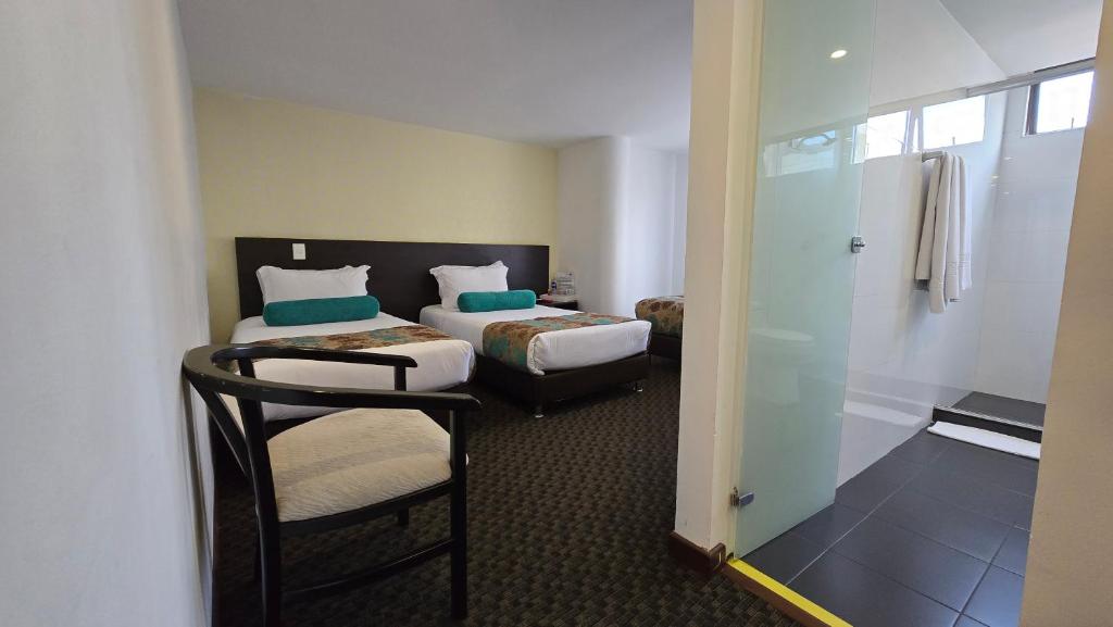 Postel nebo postele na pokoji v ubytování Castellana 95 Bogota By Hoteles Confort 80