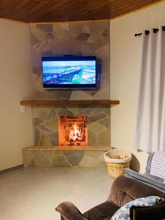 TV a/nebo společenská místnost v ubytování Chalé Vista Verde