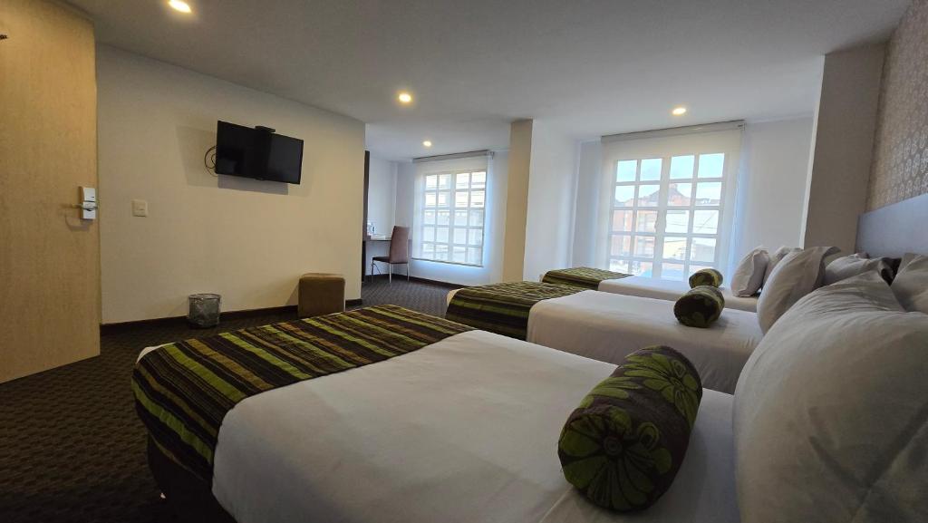Postel nebo postele na pokoji v ubytování Castellana 95 Bogota By Hoteles Confort 80