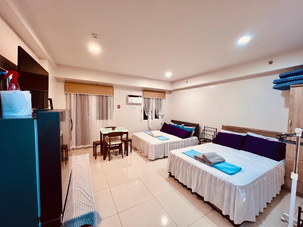 Ένα ή περισσότερα κρεβάτια σε δωμάτιο στο Spacious,comfy condo @ SM Iloilo