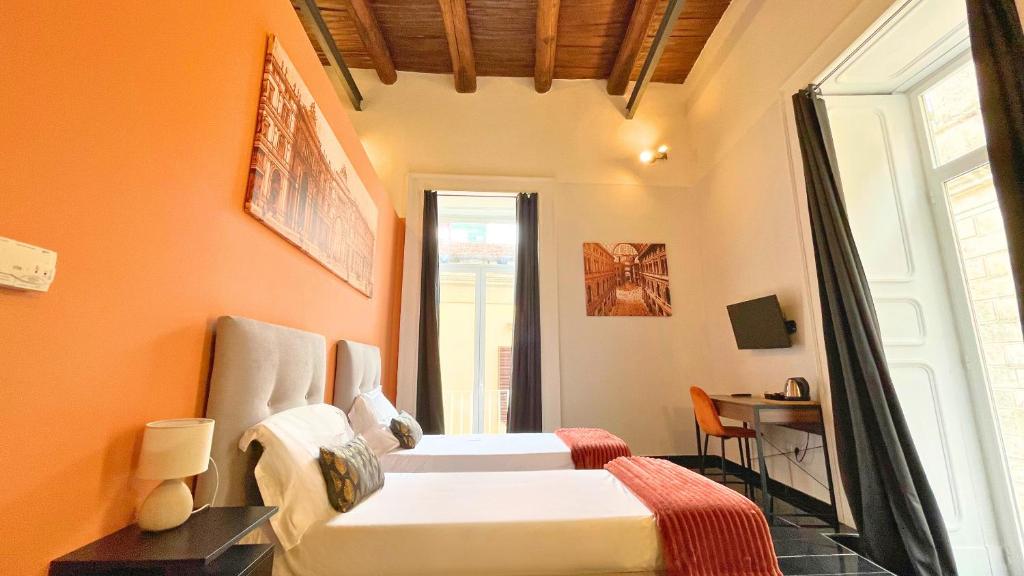 Postel nebo postele na pokoji v ubytování Palazzo Goyze