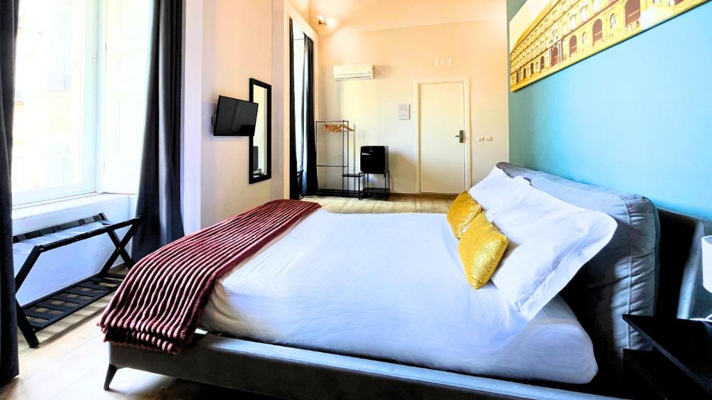 Postel nebo postele na pokoji v ubytování Palazzo Goyze