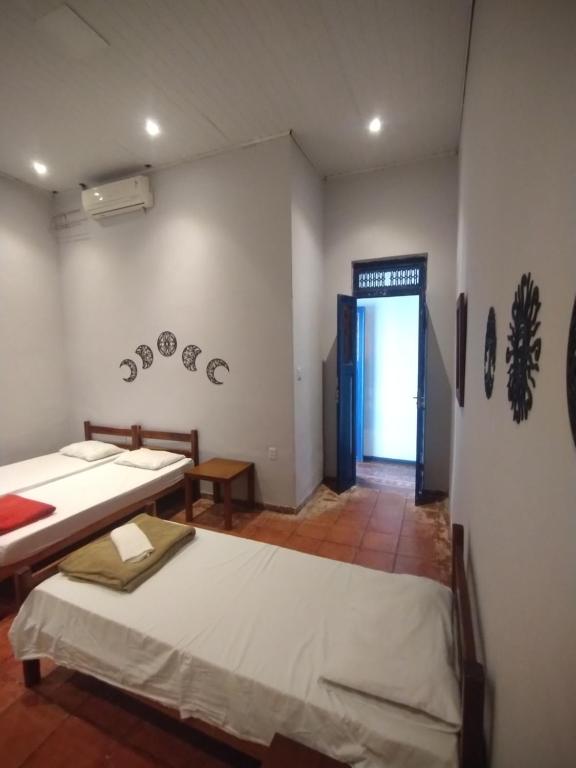 Postel nebo postele na pokoji v ubytování Pousada e Hostel Andarai