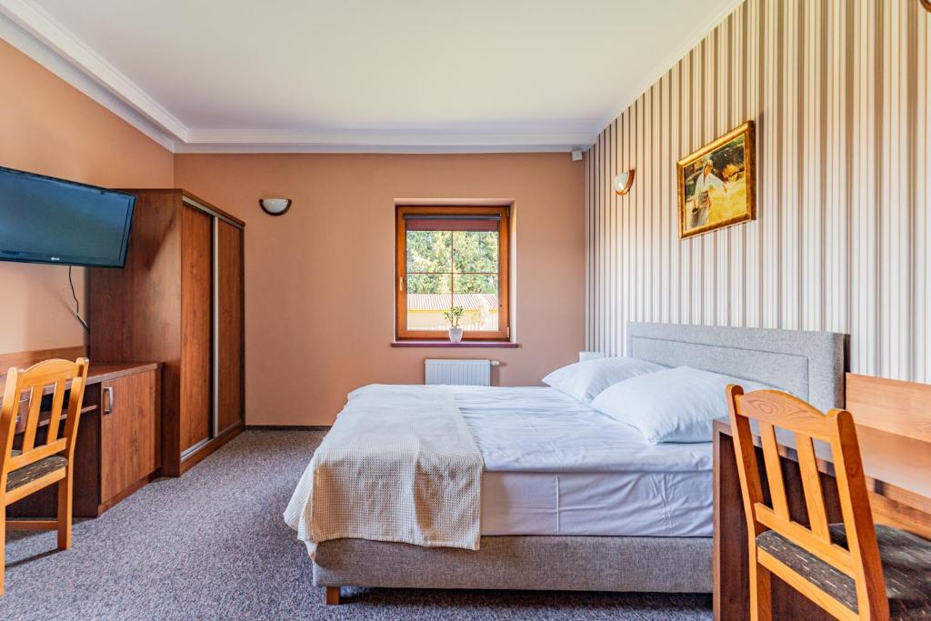 Postel nebo postele na pokoji v ubytování Zajazd Żuławy - Restauracja & Hotel