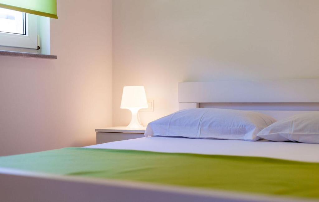Posteľ alebo postele v izbe v ubytovaní Apartments Ana