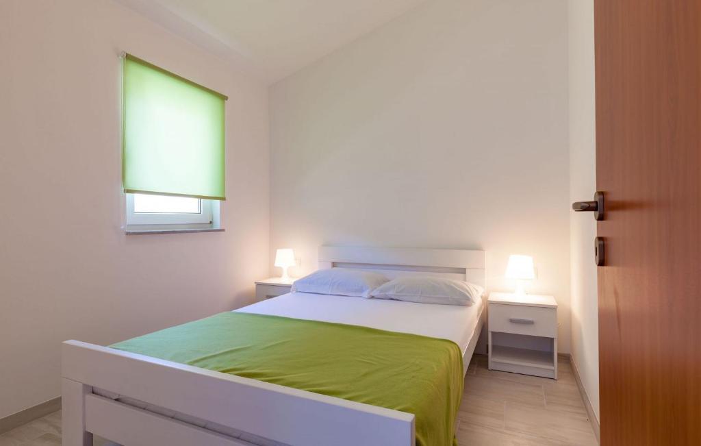 Posteľ alebo postele v izbe v ubytovaní Apartments Ana