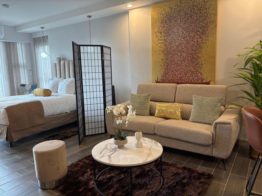 Posezení v ubytování Cozy Apartment 10 min to Airport Be Cariari Condo #402