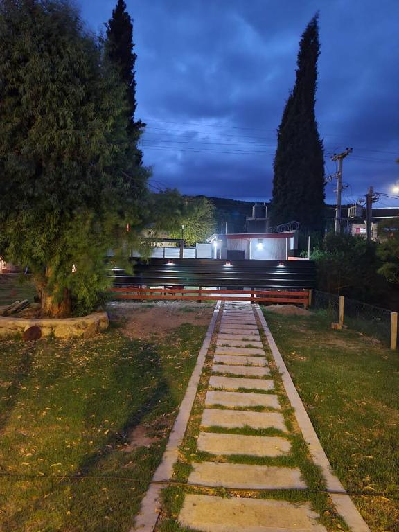 a walkway in a park at night at Estudio Relax Las Sierras in El Volcán