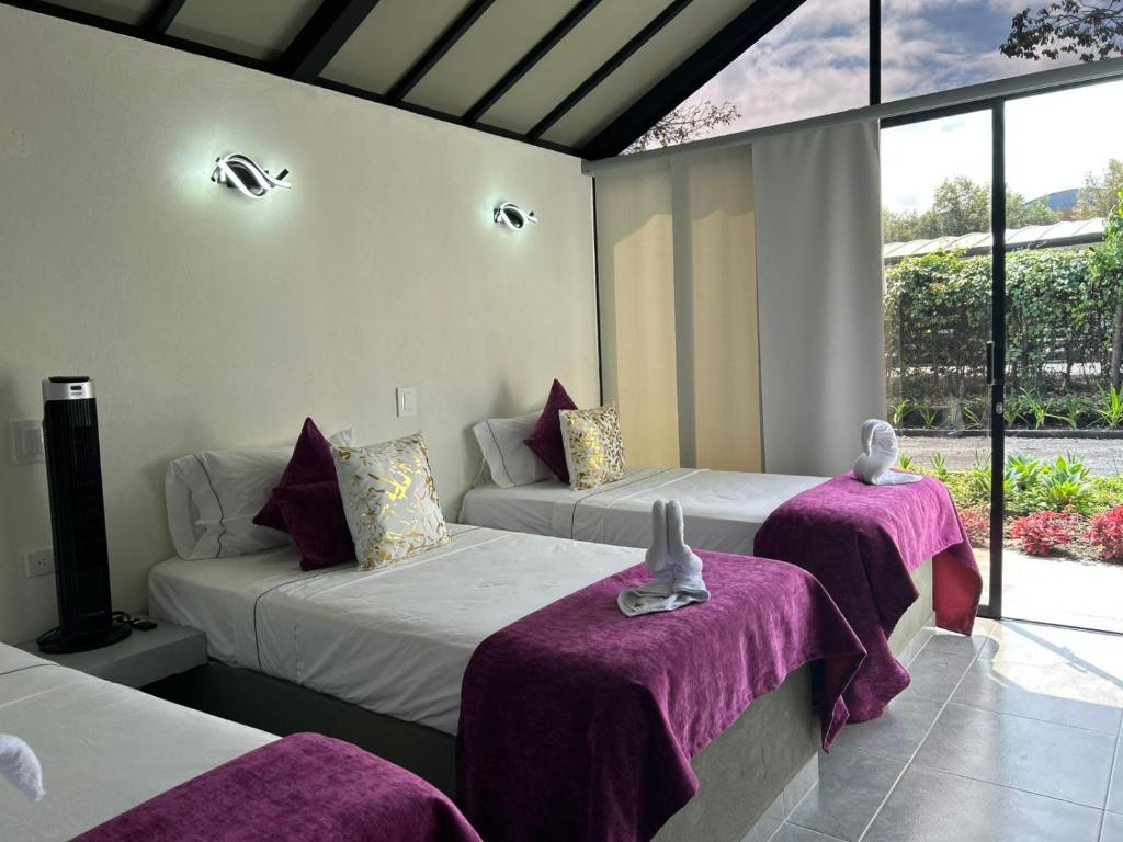 Postel nebo postele na pokoji v ubytování STAR CENTER Hotel Boutique