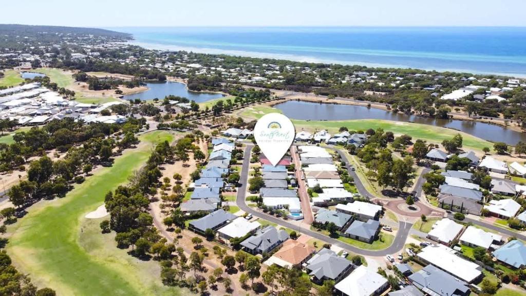 an aerial view of a resort with a large white tower at Across the Way, golf and beach heaven in Dunsborough