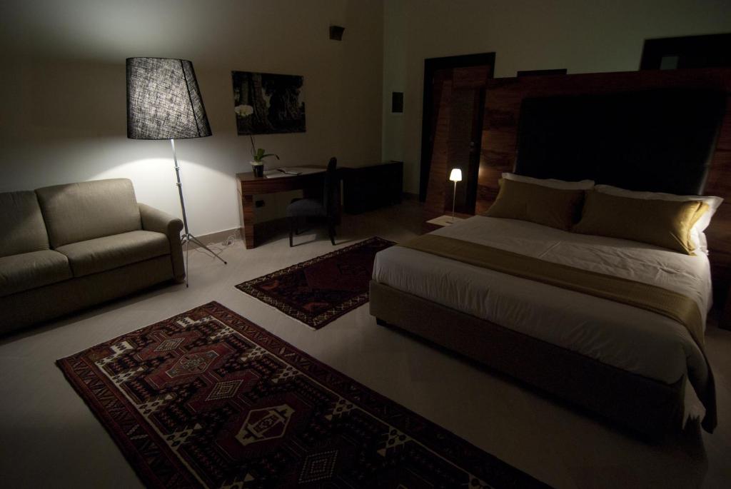 Postel nebo postele na pokoji v ubytování Alvino Suite And Breakfast
