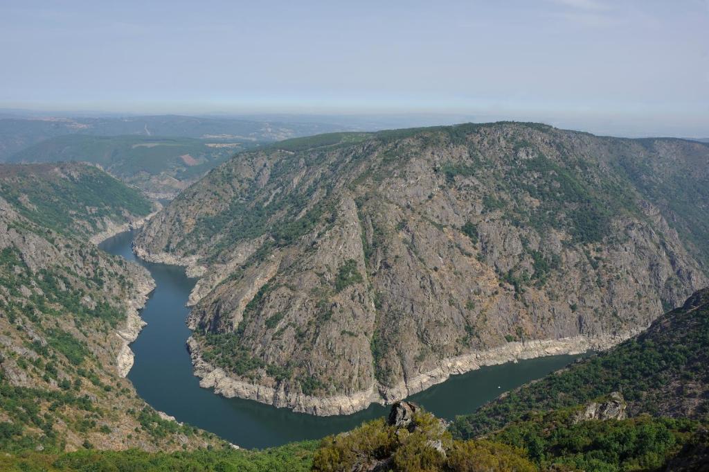 an aerial view of a mountain with a lake at A Casa da Eira in Cerreda