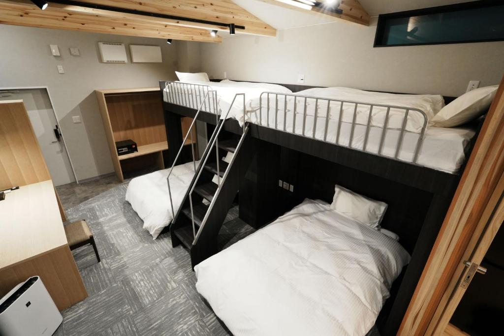 Postel nebo postele na pokoji v ubytování Hotel Soboku