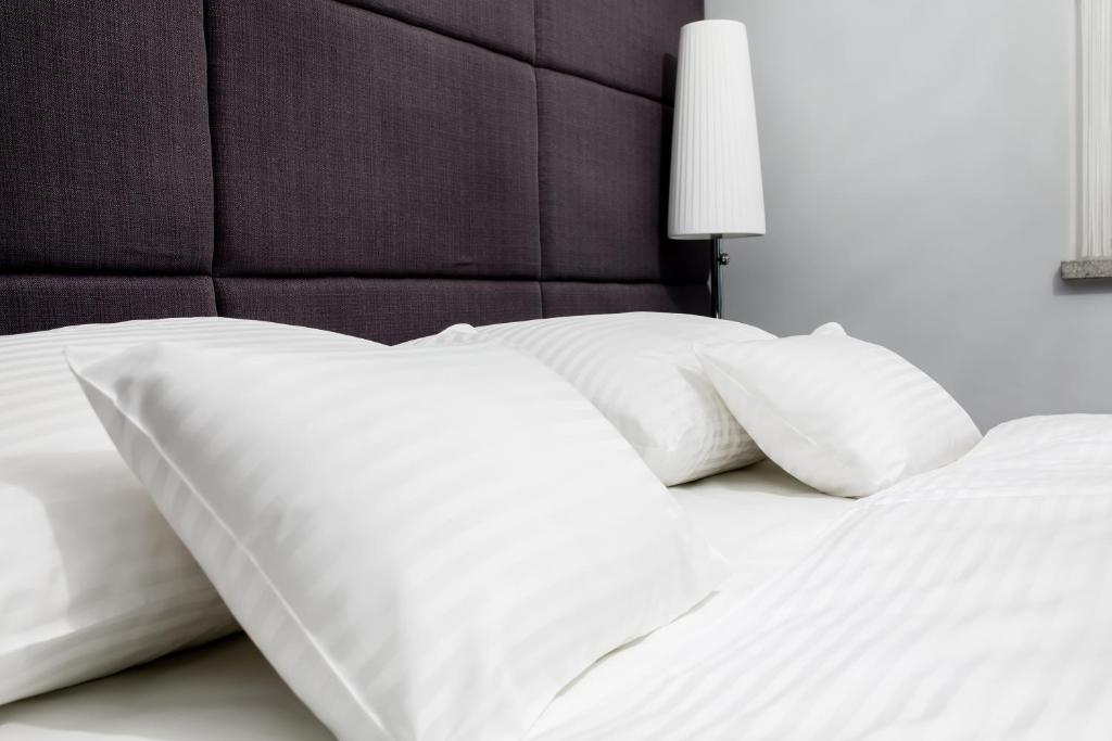 Postel nebo postele na pokoji v ubytování WH Apartments