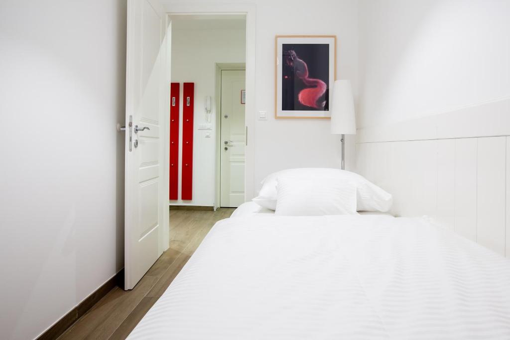 Postel nebo postele na pokoji v ubytování WH Apartments
