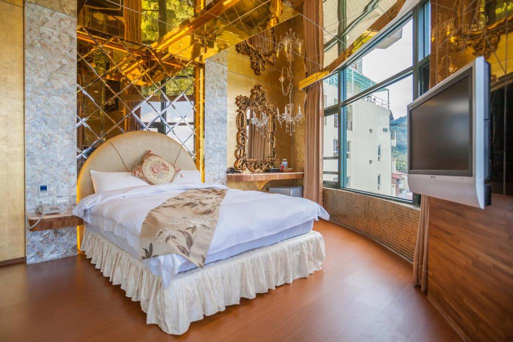 Postel nebo postele na pokoji v ubytování Shuian Lakeside Hotel