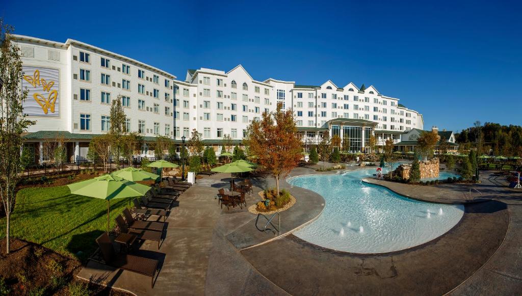 a hotel with a large pool in front of a building at Dollywood's DreamMore Resort and Spa in Pigeon Forge