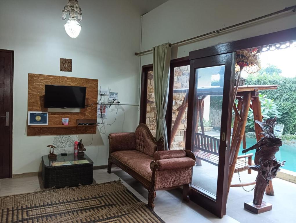 TV a/nebo společenská místnost v ubytování Calmness Villa Syariah