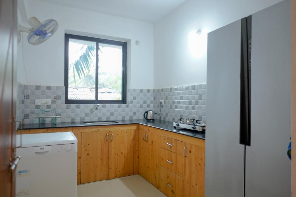 Kuchyň nebo kuchyňský kout v ubytování 1 BHK Private Apartment with a Balcony